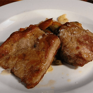 Secreto ibérico con cebolla caramelizada